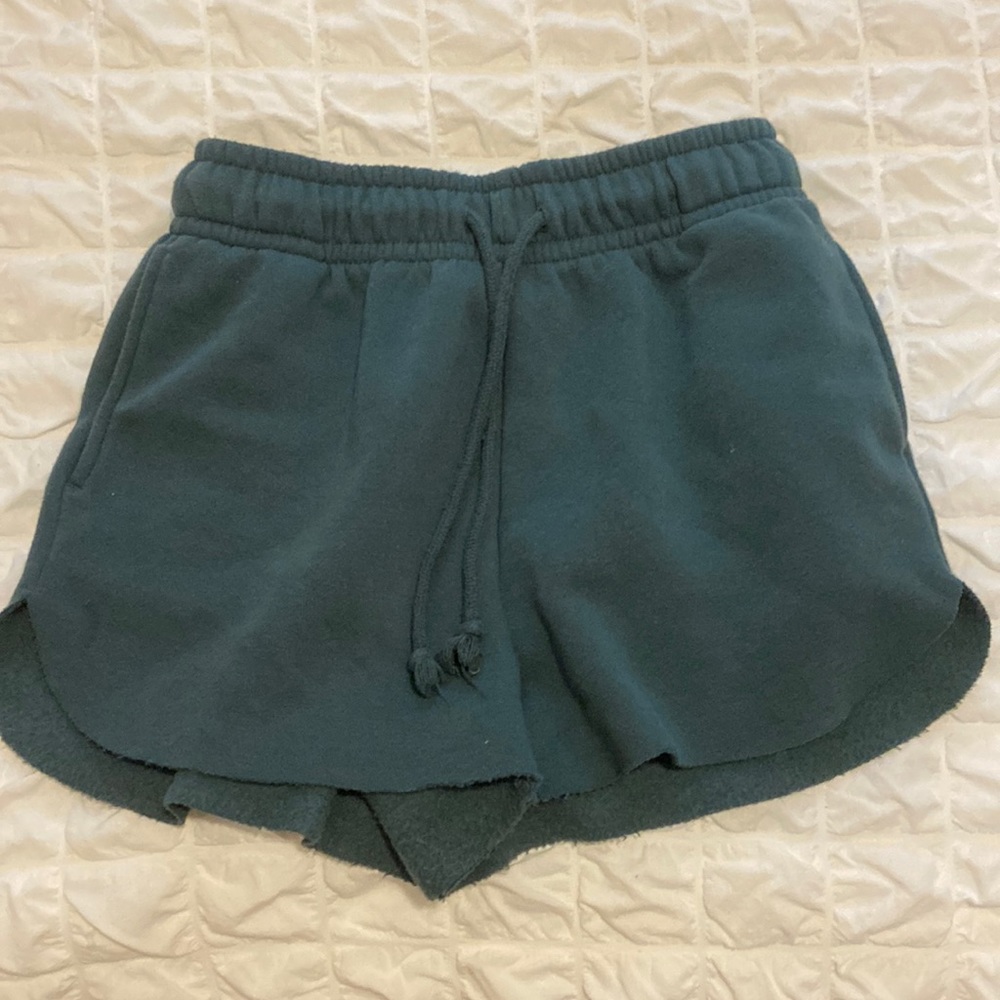 green sweat shorts